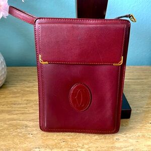 cartier wristlet clutch with outside phone pocket